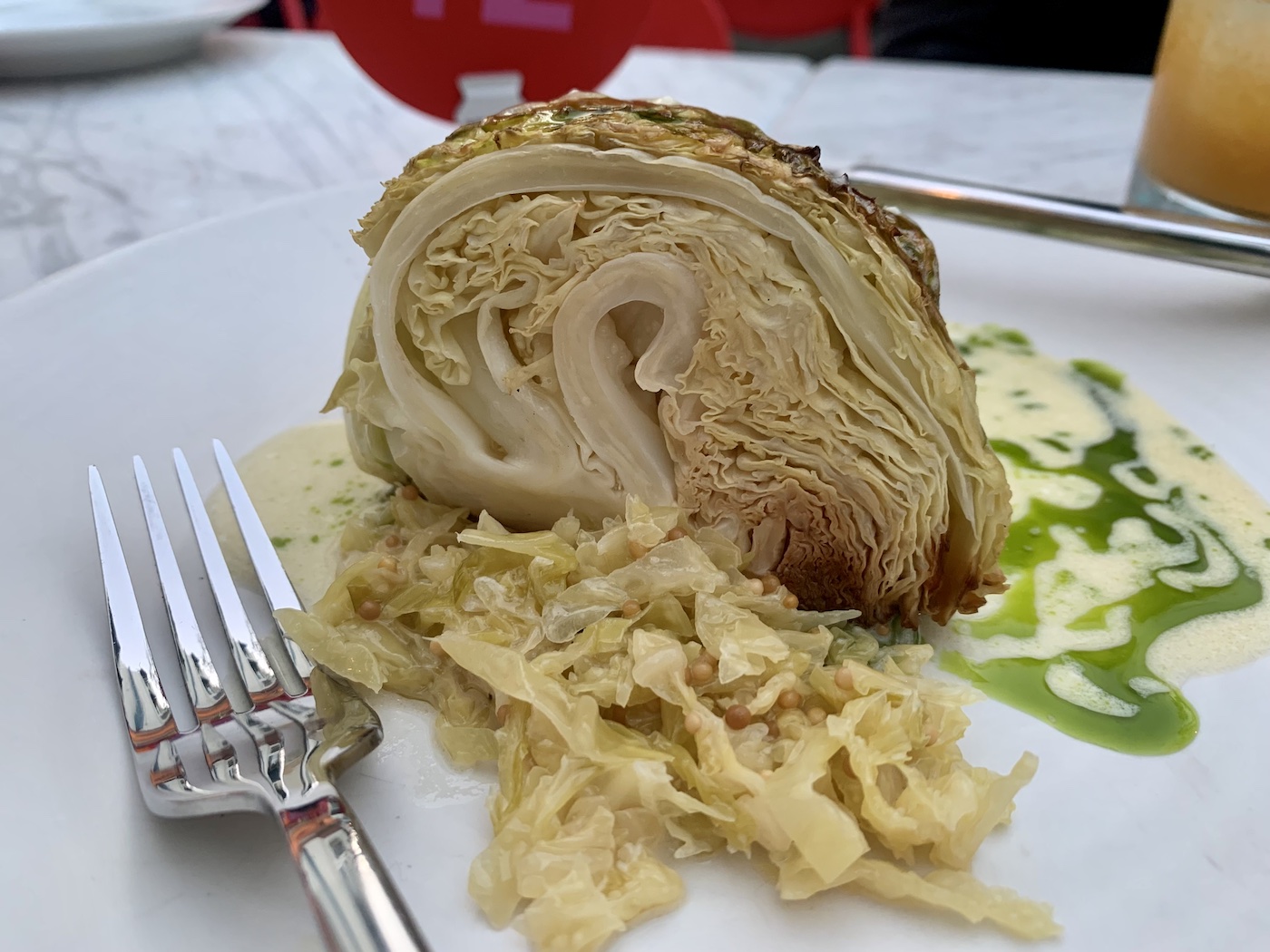 cabbage atop sauerkraut, a fork and craime fraiche.